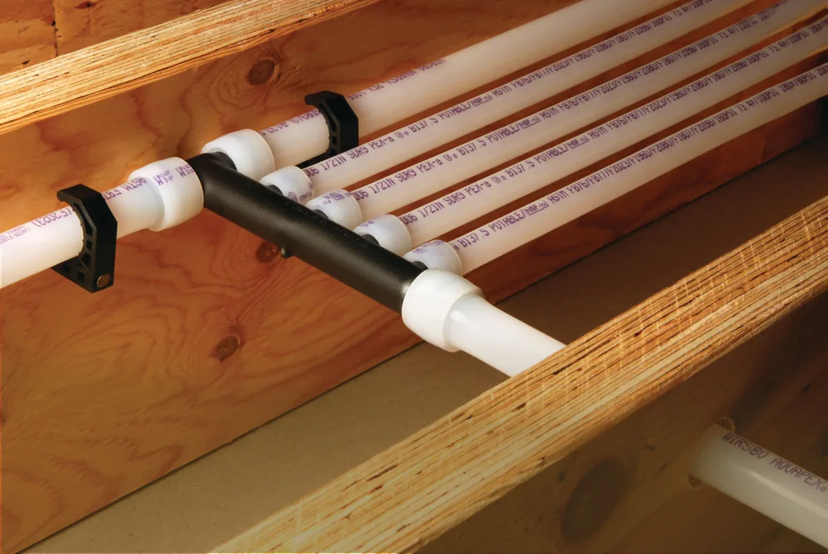 PEX-A multiport tee distributing water lines along joists – Before Your Rinnai Tankless Water Heater Installation for Dana Point, CA homes